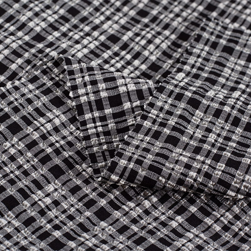 Tela Jacquard de burbujas de moda de nailon y poliéster blanco y negro de 130gsm