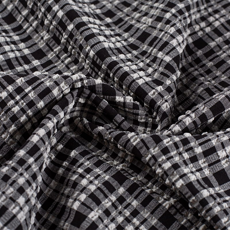 Tela Jacquard de burbujas de moda de nailon y poliéster blanco y negro de 130gsm