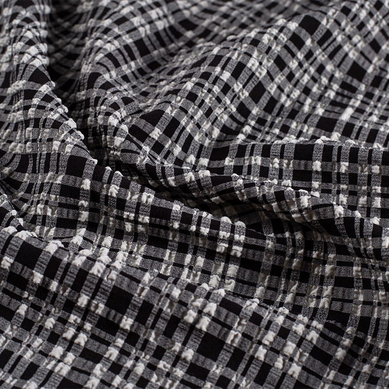 Tela Jacquard de burbujas de moda de nailon y poliéster blanco y negro de 130gsm